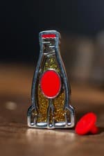 Image of OFFICAL FALLOUT NUKA COLA BOTTLE GLITTER PIN NEW SEALED