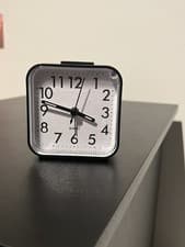 Image of Compact Quartz Alarm Clock – Black & Silver Sleek and simple analog quartz alarm