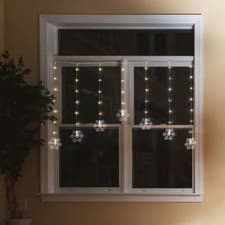 Image of Festive Magic Warm White Battery Operated Snowflake Curtain