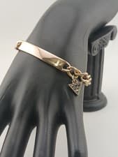 Image of Designer GUESS muted goldtone black stones charm I.D. cable chain bracelet
