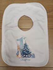 Image of baby 1st Christmas bibs Peter Rabbit Themed Blue