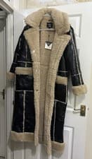 Image of QED London Vinyl Longline Coat With Borg Contrast in black faux leather.RRP £200