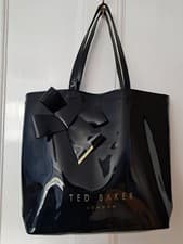 Image of Ted Baker London Nikiton Black Patent Vinyl Tote. Knot Bow Detail. Gold Logo