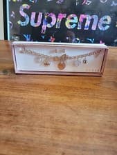 Image of GUESS Gold Tone 7.5” Charm Bracelet Earrings Set New In Box Accented Charms