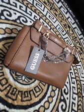Image of A Beautiful Women Guess Bag With Long Strap