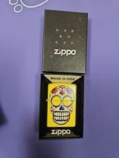 Image of Genuine Zippo Windproof Refillable Pocket Lighter Yellow Skull Design