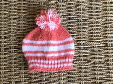 Image of BRAND NEW HAND KNITTED TERRACOTTA &CREAM STRIPED POM POM BEANIE HAT SIZE NEWBORN
