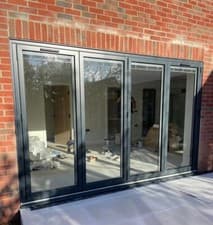 Image of Grey Aluminium Bi-Fold Doors | Contemporary Exterior Look
