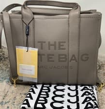 Image of Marc Jacobs Medium Tote Crossbody/ 100% Leather  The Tote This Season in Cement