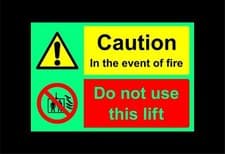 Image of Caution in the event of fire do not use this lift Safety sign - Photoluminescent