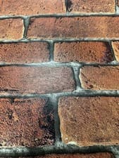 Image of TEXTURED VINYL WASHABLE RED BRICK REALISTIC 3D WALLPAPER - SLIGHT IMPERFECT