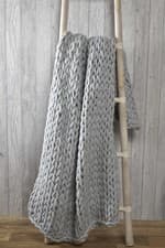 Image of Modern Chunky Cable Knit Throw Over Luxury Large Soft Sofa Bed Blanket