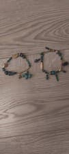 Image of Pack of 2 teal and gold bracelets from Accessorize