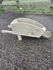 Image of Wooden garden wheelbarrow planter