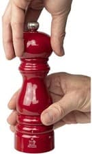 Image of Peugeot Glossy Red Pepper Mill 18cm filled with peppercorns