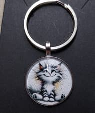 Image of absolutely gorgeous black and white cat keyring with domed clear cabochon
