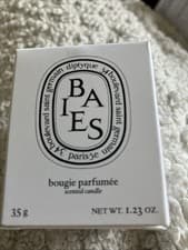 Image of White 'Baies' scented candle from Diptyque , glass container.35g Perfumed