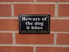 Image of Black beware of the dog it bites you have been warned sign - All Materials