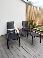 Image of Brooke 5 piece black garden bistro set with foot stools