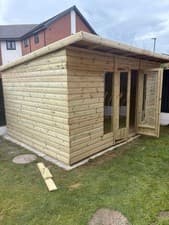 Image of 10x8 Pent Summerhouse In 21mm Tanalised Loglap Wood Topped Off Quality Felt Roof