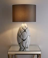 Image of Tall white with silver Table lamp in a ceramic finish and dark grey lampshade