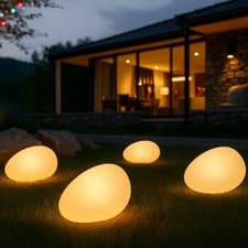 Image of LED Solar Garden Pebble Lights 4 Pack Outdoor Glowing Stones Path Decor