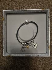 Image of Harry Potter black leather charm bracelet with charm and spell beads. 