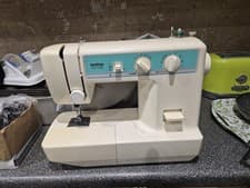 Image of Brother Sewing with Foot Control and Has a Power Cord Also Has Some Accessories