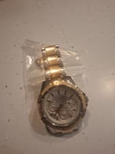 Image of This is a Guess silver-tone watch with a crystal-encrusted dial and bezel.