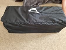 Image of Joie Travel Cot in grey and black with adjustable insert