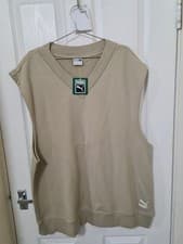 Image of Puma Wardrobe Essentials relaxed vest in a beige color