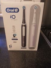 Image of Brand New Oral-B iO Series 4 Electric Toothbrush Duo Pack Black ,pink