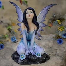 Image of Enchanting Azure Bloom Fairy Figurine Blue Flower Statue Magical Myth Ornament