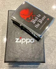 Image of Genuine Brand New 2006 ZIPPO Lighter BAD TO THE BONE Red Skull Brilliant Chrome