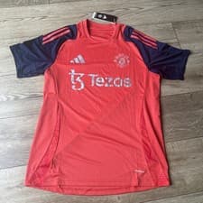 Image of Manchester United Football Tiro 2024 25 Training Top Medium Adidas Tezos Red