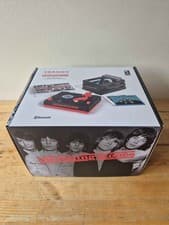 Image of (RSD26) Rolling Stones RSD3 Turntable with Crate and Six 3-Inch Singles in hand