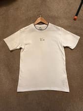 Image of Nike womens Air T-shirt in white with a gold tick