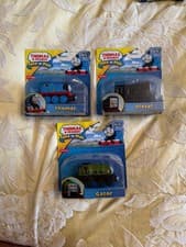 Image of thomas the tank engine and a couple of friends still in the original packaging