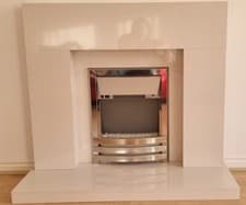 Image of fireplace surround with electric fire