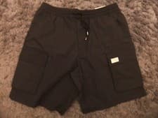 Image of Black cargo style shorts to fit waist 32 inch.With pockets.