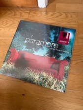 Image of Paramore All We Know Is Falling 2xLP Deluxe RSD 2026 Red Vinyl Record In Hand