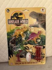 Image of Dinosaur World playset featuring assorted plastic dinosaur figures + accessories