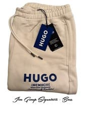 Image of Hugo Neves Cream jogging bottoms with blue logo RRP £99
