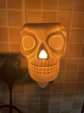 Image of DESIRE AROMA HALLOWEEN WHITE SKULL WAX MELT / OIL PLUG IN BURNER