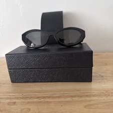 Image of PRADA PR 26ZS 16K08Z Unisex Irregular Sunglasses - Black/Gray