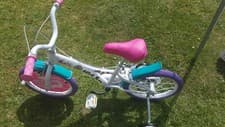 Image of girls 16 inch bike with stabilisers