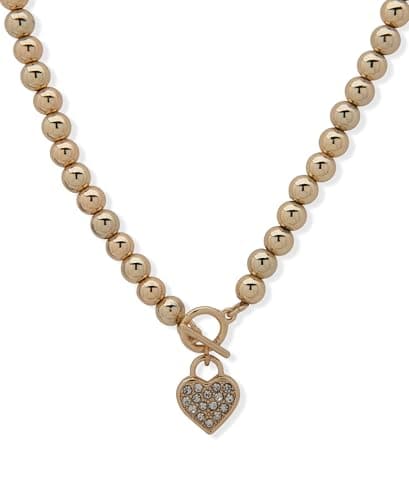 Image of Anne Klein 16" Gold necklace featuring 3" extender, toggle styling, pave heart drop charm, and lobster clasp closure