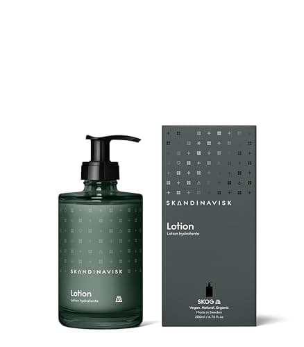 Image of Skandinavisk SKOG ‘Forest’ Hand & body lotion, Scent notes: Pine needles and fir cones, birch sap and woodland lily of the valley, Coloured glass bottle with pump, 200 ml