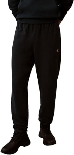 Image of Calvin Klein Men's EU 350TERRY Monogram Jogger LV04RD241G Sweatpants, Blue (Nurture Navy), M