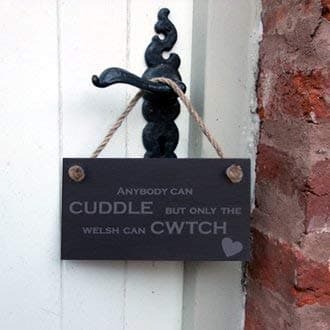 Image of Anybody can cuddle, but only the Welsh can cwtch - Slate Hanging Sign